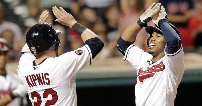 Cleveland Indiansí Francisco Lindor, right, celebrates with Jason Kipnis after Lindor hit a three-run home run off Kansas City Royals relief pitcher Joe Blanton in the seventh inning of a baseball game, Monday, July 27, 2015, in Cleveland. Kipnis and Giovanny Urshela scored on the play. (AP Photo/Tony Dejak)