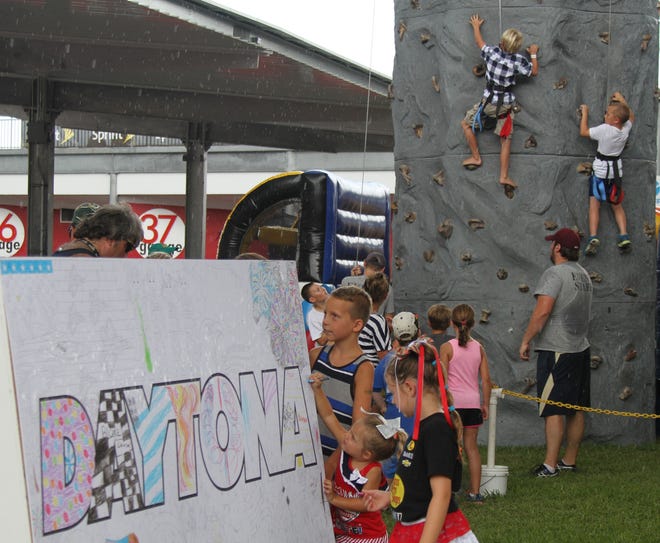 The Fan Zone at Daytona International Speedway offers fun and games for young race fans before Saturday's Coke Zero 400 race. NEWS-JOURNAL/DAVID TUCKER
