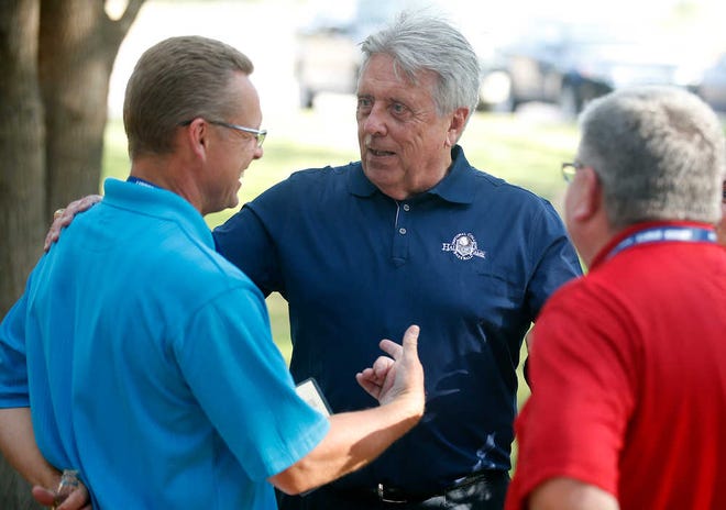 College Baseball Hall of Fame inductee Rick Monday, center, talks to Hall of Fame President Mike Gustafson, left, and Kyle Rogers, right, during a reception Friday at Spirit Ranch in Lubbock.