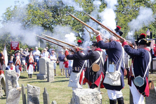 The Artillery Company of Newport gives a four-musket salute during a graveside homage to William Ellery on Monday at the Common Burying Ground.