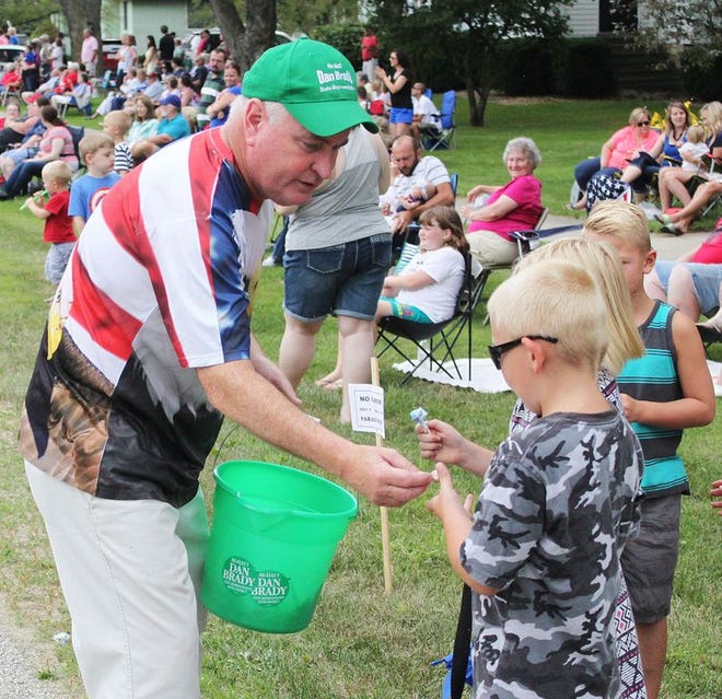 State Rep. Dan Brady hands out candy during the annual Fourth of July Parade in Chenoa on Monday.