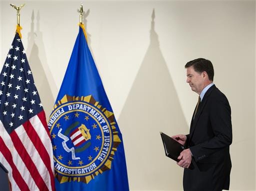FBI Director James Comey walks to the podium to make a statement at FBI Headquarters in Washington, Tuesday, July 5, 2016. Comey said the FBI will not recommend criminal charges in its investigation into Hillary Clinton's use of a private email server while secretary of state. (AP Photo/Cliff Owen)