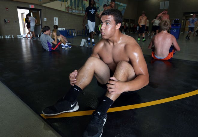Don Ross, 16, of West Burlington does sit-ups during a five-day fitness camp hosted by the Iowa Army National Guard last year at the Middletown Armed Forces Reserve Center.