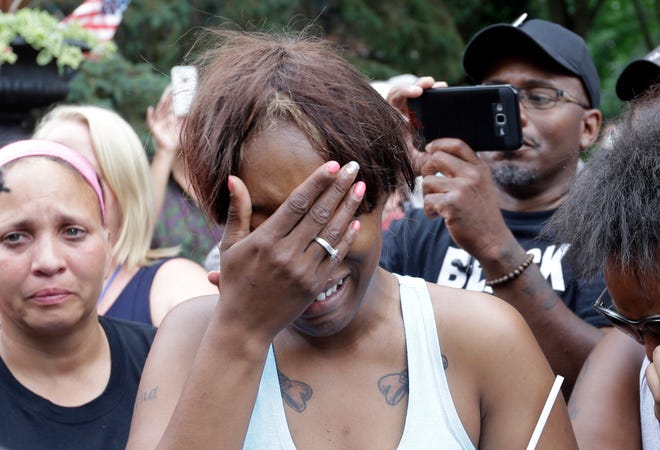 Diamond Reynolds, the girlfriend of Philando Castile of St. Paul, cries outside the governor's residence in St. Paul, Minn., on Thursday, July 7, 2016. Castile was shot and killed after a traffic stop by police in Falcon Heights, Wednesday night. A video shot by Reynolds of the shooting went viral. (AP Photo/Jim Mone)
