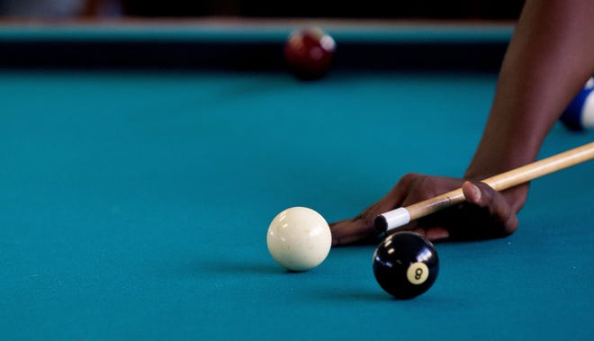 In this 2014 file photo, a 16-year-old boy plays pool at the Boys and Girls Club in Ocala. The organization is facing serious financial challenges. (File photo)