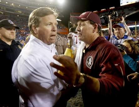 Florida coach Jim McElwain, left, and Florida State coach Jimbo Fisher shake hands after the game Nov. 28 2015 in Gainesville. Florida State defeated Florida 27-2.