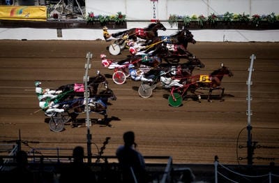 Drivers lead their horses out of the start during last summer's Illinois State Fair Colt Stakes 2-Year-Old Colts & Geldings race. Justin L. Fowler/The State Journal-Register