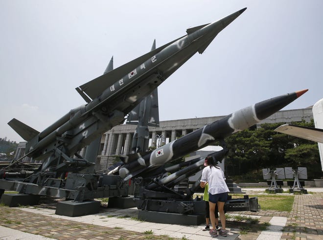 South Korea's mock missiles are displayed at the Korea War Memorial Museum in Seoul, South Korea, Friday, July 8, 2016. U.S. and South Korean military officials said Friday they're ready to deploy an advanced U.S. missile defense system in South Korea to cope with North Korean threats. The announcement will raise strong objections in Beijing, Moscow and Pyongyang. Korean letters on the mock missile read: "Republic of Korea Army." (AP Photo/Lee Jin-man)