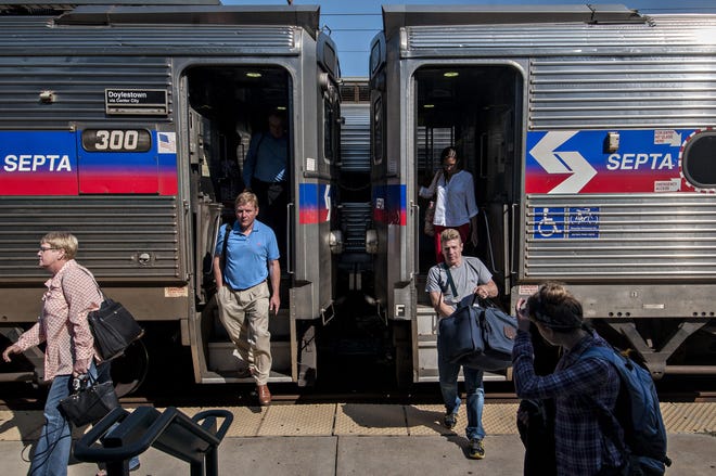 (File) Commuters step off SEPTA regional rail cars at the Doylestown station Tuesday, July 5, 2016. SEPTA commuters will be affected by the rail system's decision to shut down many of its fleet of rail cars.