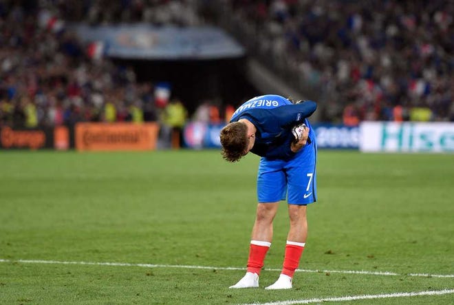 France's Antoine Griezmann bows to the supporters at the end of the Euro 2016 semifinal between Germany and France in Marseille, France, on Thursday. Griezmann scored both goals in France's 2-0 win.