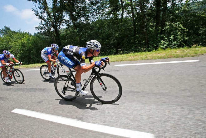Belgium's Iljo Keisse, front is followed by France's Thibaut Pinot as they speed downhill during the seventh stage of the Tour de France cycling race over 162.5 kilometers (100.7 miles) with start in L'Isle-Jourdain and finish in Lac de Payolle, France, Friday, July 8, 2016. (AP Photo/Christophe Ena)
