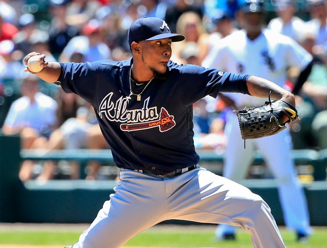 Atlanta Braves starter Julio Teheran delivers a pitch during the first inning of a baseball game against the Chicago White Sox, Saturday, July 9, 2016, in Chicago. (AP Photo/Kamil Krzaczynski)