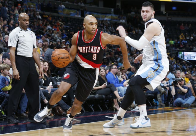 Trail Blazers guard Gerald Henderson drives past Nuggets center Jusuf Nurkic in first half of a Jan. 3, 2016, game in Denver. (AP Photo/David Zalubowski, File)