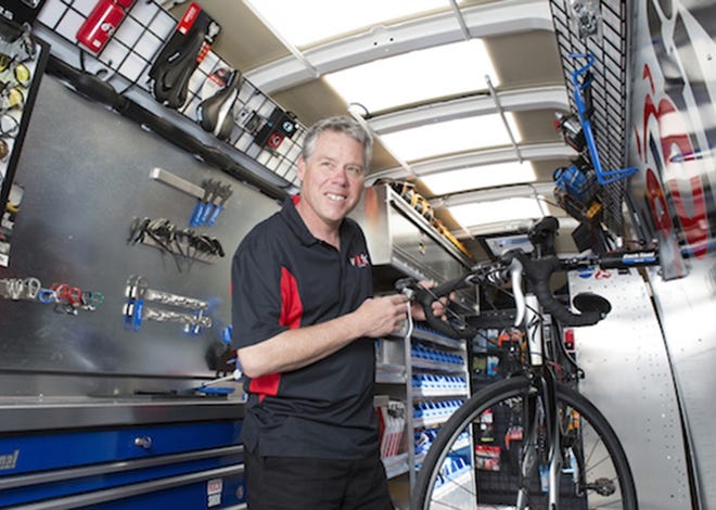Mike Lee, owner of mobile bike shop Velofix Southcoast RI-MA, inside his repair van. Marianne Lee Photography