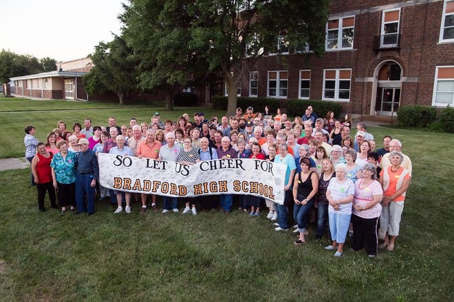 PHOTO COURTESY OF HEATHER FRYKMAN Bradford High School graduate Heather Frykman, class of '91, took this group photo of graduates, teachers, and others Friday in front of the 77-year-old building that will soon be demolished. Alumni from as early as 1951 took part in a reunion that night. At left is the adjacent Junior High, which will remain in operation.