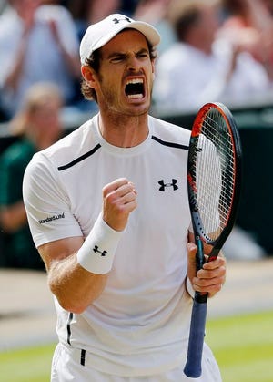 Andy Murray of Britain celebrates a point against Milos Raonic of Canada during the men's singles final on the fourteenth day of the Wimbledon Tennis Championships in London, Sunday, July 10, 2016.