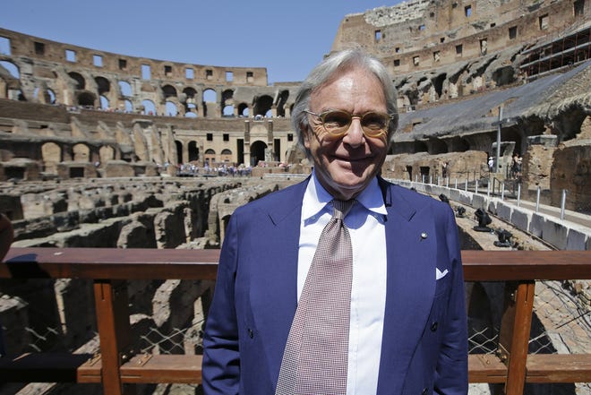 Tod's founder Diego Della Valle, who is paying 25 million euros for the project, poses inside the Colosseum after the first stage of the restoration work was completed in Rome, Friday, July 1st, 2016. The Colosseum has emerged more imposing than ever after its most extensive restoration, a multi-million-euro cleaning to remove a dreary, undignified patina of soot and grime from the ancient arena, assailed by pollution in traffic-clogged Rome. (AP Photo/Andrew Medichini)