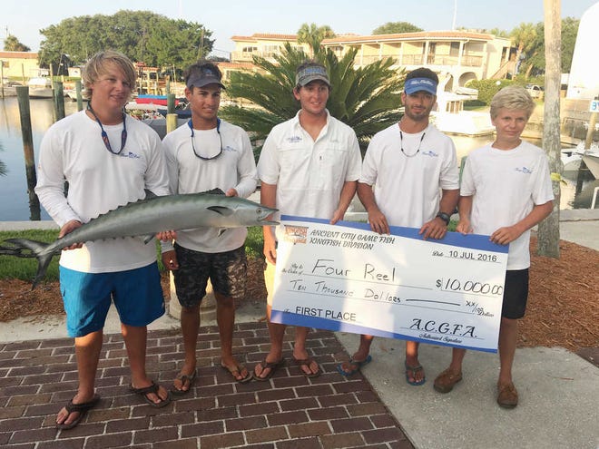 CONTRIBUTED/ The Four Reel team won the 21st annual Ancient City Game Fish Association Kingfish Challenge with a 79.82-pound two-fish aggregate. Harrison Englert, Cade Macri, Hayden Englert, Hanson Englert and Jack Richardson hold the kingfish trophy and the $10,000 check for first place. Michael Syrakas is not pictured.