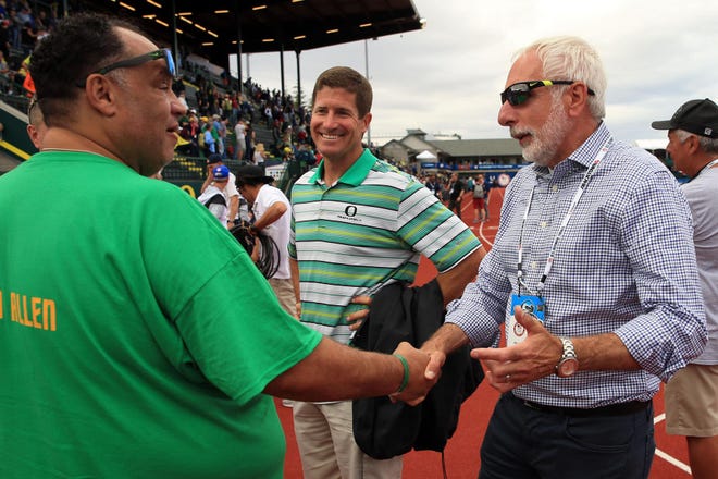 TrackTown USA president Vin Lananna (right) speaks with Devon Allen's father, Louis, (left) after Allen won the 110-meter hurdles at the 2016 U.S. Olympic Track and Field Trials at Hayward Field in Eugene, Ore., on Saturday, July 9, 2016. (Collin Andrew/The Register-Guard)