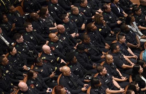 Law enforcement officers attend an interfaith memorial service for the fallen police officers and members of the Dallas community, Tuesday, July 12, 2016, at the Morton H. Meyerson Symphony Center in Dallas. (AP Photo/Susan Walsh)