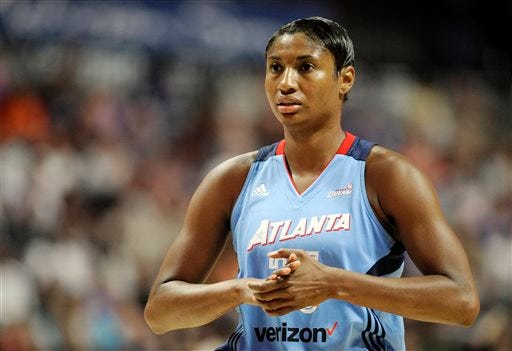 FILE - In this July 10, 2016, file photo, Atlanta Dream"™s Angel McCoughtry watches during the first half of a WNBA basketball game against the Connecticut Sun in Uncasville, Conn. The WNBA had a bit of triple-double trouble over the past 10 days. There had been only five during the regular season in the 20-year history of the league. There were potentially two more by Brittney Griner and McCoughtry. The two stars thought they had achieved the rare feat, only to have the league review the games and take them away because of stat errors. By (AP Photo/Jessica Hill, File)