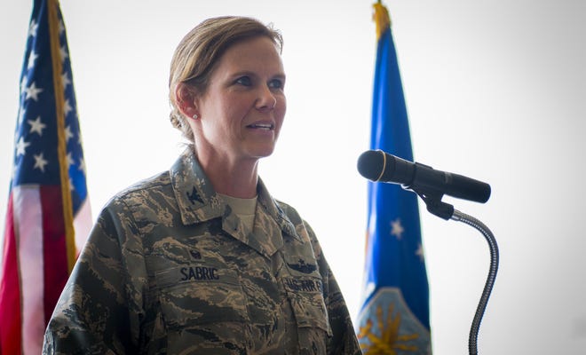 Col. Regina Sabric addresses her new group at the 919th Special Operations Group's change of command ceremony June 12 at Duke Field, Florida. Sabric was stationed at the Pentagon before becoming the first female commander of the group. (U.S. Air Force photo/Tech. Sgt. Sam King)