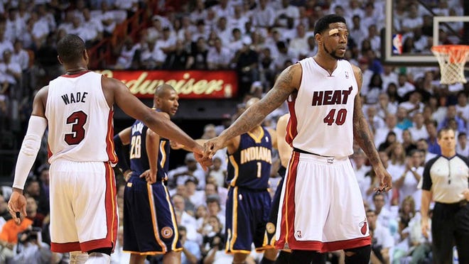 052212 Miami Heat shooting guard Dwyane Wade (3) and Miami Heat power forward Udonis Haslem (40) bump fists after Wade was fouled by Indiana Pacers power forward Tyler Hansbrough (50) at AmericanAirlines Arena in Miami, FL. (Allen Eyestone/The Palm Beach Post)