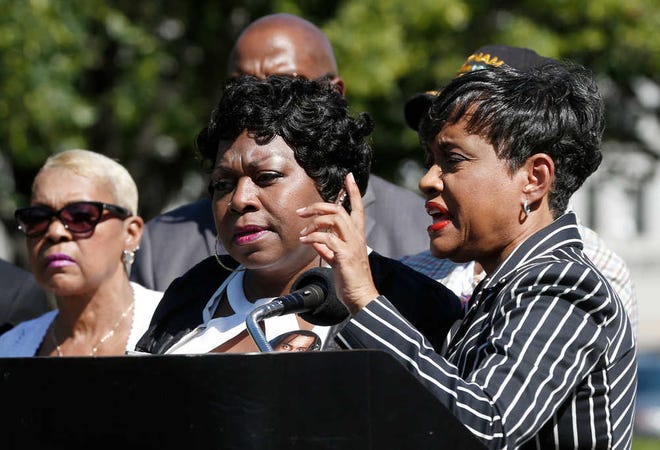TV Judge Glenda Hatchett, right, speaks as Valerie Castile, the mother of Philando Castile, listens during a news conference on the State Capitol grounds Tuesday, July 12, 2016, in St. Paul, Minn. Hatchett is representing the Castile family in the shooting death by police of Philando Castile last week in Falcon Heights, Minn. after a traffic stop by St. Anthony police. (AP Photo/Jim Mone)