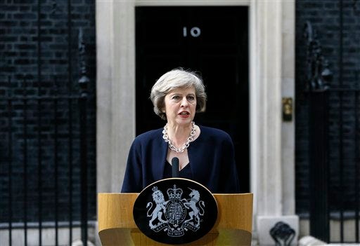 New British Prime Minister Theresa May speaks to the media outside her official residence,10 Downing Street in London, Wednesday July 13, 2016. David Cameron stepped down Wednesday after six years as prime minister. (AP Photo/Kirsty Wigglesworth)