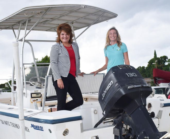 Tina Rushing, CHELCO marketing representative, and Brandy Foley, CBA monitoring coordinator, discuss how crucial the new boat motor is to continuing the CBA mission.