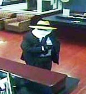 Horsham police and the FBI are asking the public's assistance in identifying the suspect in last Friday's armed robbery of the Colonial American Bank.