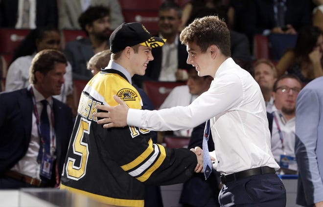 Jake Debrusk (left) and Zachary Senyshyn congratulate each other after they were chosen 14th and 15th overall by the Bruins during the first round in June, 2015.