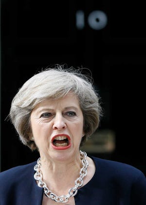 New British Prime Minister Theresa May speaks to the media outside her official residence, 10 Downing Street in London, on Wednesday.