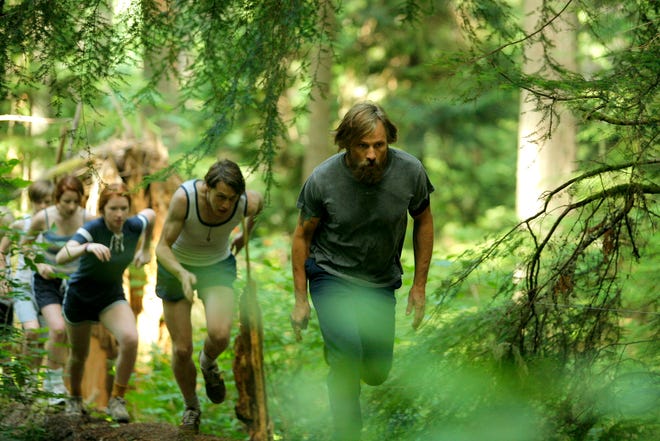 Ben (Viggo Mortensen) leads his kids through the woods on a training session. (Electric City Entertainment)