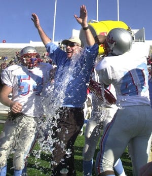 Southside players drench Coach Barry Lunney after winning the 5A state championship game over Springdale on Dec. 7, 2002, at War Memorial Studiam in Little Rock. BRIAN D. SANDERFORD/TIMES RECORD