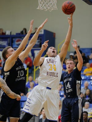 Embry-Riddle's Joseph Gonzalez (34) attempts to shoot to the rim over during ERAU's first NCAA Division II game with Palm Beach Atlantic on Nov. 18, 2015. NEWS-JOURNAL FILE/NIGEL COOK