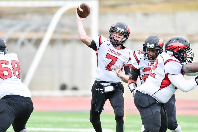 Levelland quarterback Nick Gerber (7) looks for the connection with receiver Jefferey Elliot (9) during their regional playoff game against Abilene Wylie.
