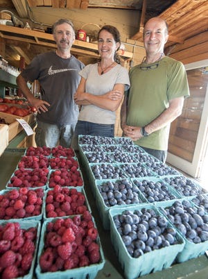Farmers Brad Towle, Holly Philbrick-Craig, and David Hills, plan to open a cafe at the Emery Farm stand on Route 4. Hills is the owner of the farm. Photo by John Huff/Fosters.com