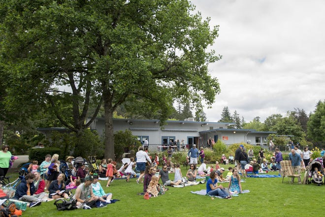 The audience at the 21st annual Teddy Bear Picnic listens to music at the Campbell Community Center in Eugene on Saturday, July 16, 2016. (Adam Eberhardt/The Register-Guard)