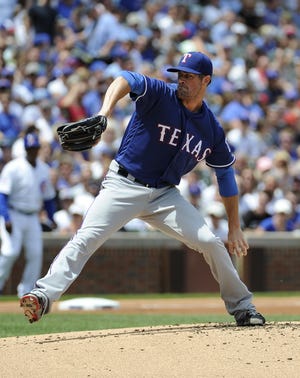 Texas Rangers starting pitcher Cole Hamels (35) throws against the Chicago Cubs during the first inning of an interleague baseball game, Sunday, July 17, 2016, in Chicago. (AP Photo/David Banks)
