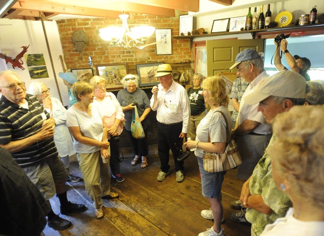 Former owner of Bishop Farmstead Ronn Shaffer (center) leads a tour through the the farmhouse Sunday, July 17, 2016. Pinelands Preservation Alliance held an open house and tour at their historic farmstead.