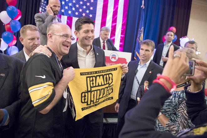 House Speaker Paul Ryan, R-Wis., poses for a photo with Michael McMullen of Gibsonia, Pa., on Monday during a breakfast with Pennsylvania delegates at the Republican National Convention in Westlake, Ohio.