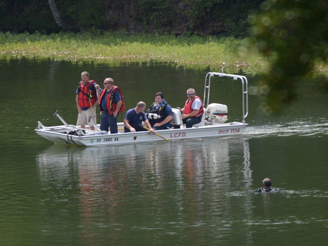 Officials search for a drowning victim in Lake Lyman Monday afternoon.