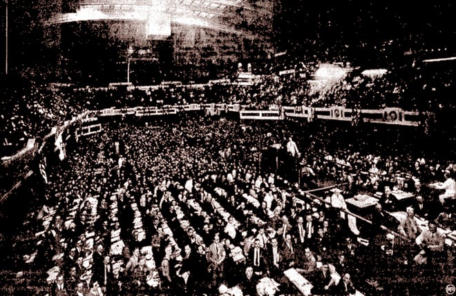 When it was published in The Evening Repository on June 10, 1936, the caption to this photograph said: "The milling, jostling, badge bedecked throng of more than 10,000 that swarmed into Cleveland's Public Hall for the opening ceremonies of the Republican national convention had settled into orderliness as this striking official picture was taken. On the speakers' stand, dressed in white, is Henry P. Fletcher, chairman of the party's national committee, who called the initial session to order." (Repository file photo)