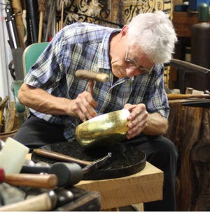 Contrubited photo Gary Noffke creates a bowl from a sheet of 24 karat gold. fghfghfghghfg