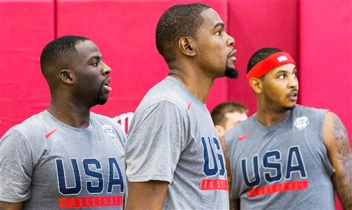 Golden State Warriors teammates Draymond Green, left, and Kevin Durant, middle, watch team drills during Team USA basketball practice in Las Vegas on Monday, July 18, 2016. (Benjamin Hager/Las Vegas Review-Journal via AP)
