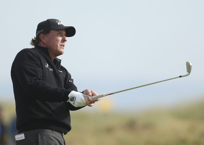 Phil Mickelson watches his shot from the 15th fairway during the final round of the British Open Golf Championship at the Royal Troon Golf Club in Troon, Scotland, on Sunday. Associated Press/Peter Morrison