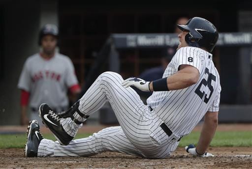 New York Yankees' Mark Teixeira (25) grimaces after fouling the ball off his ankle during the fourth inning of a baseball game against the Boston Red Sox, Saturday, July 16, 2016, in New York. (AP Photo/Julie Jacobson)