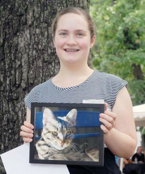 Annette Coffey shares her cat picture that she submitted for photography judging. She said although Larry, her cat, moved around a lot, he ultimately made for a good photo subject.