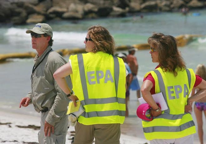 A crew from the Environmental Protection Agency scouts St. Andrews State Park in June 2010 following the Deepwater Horizon oil spill.
